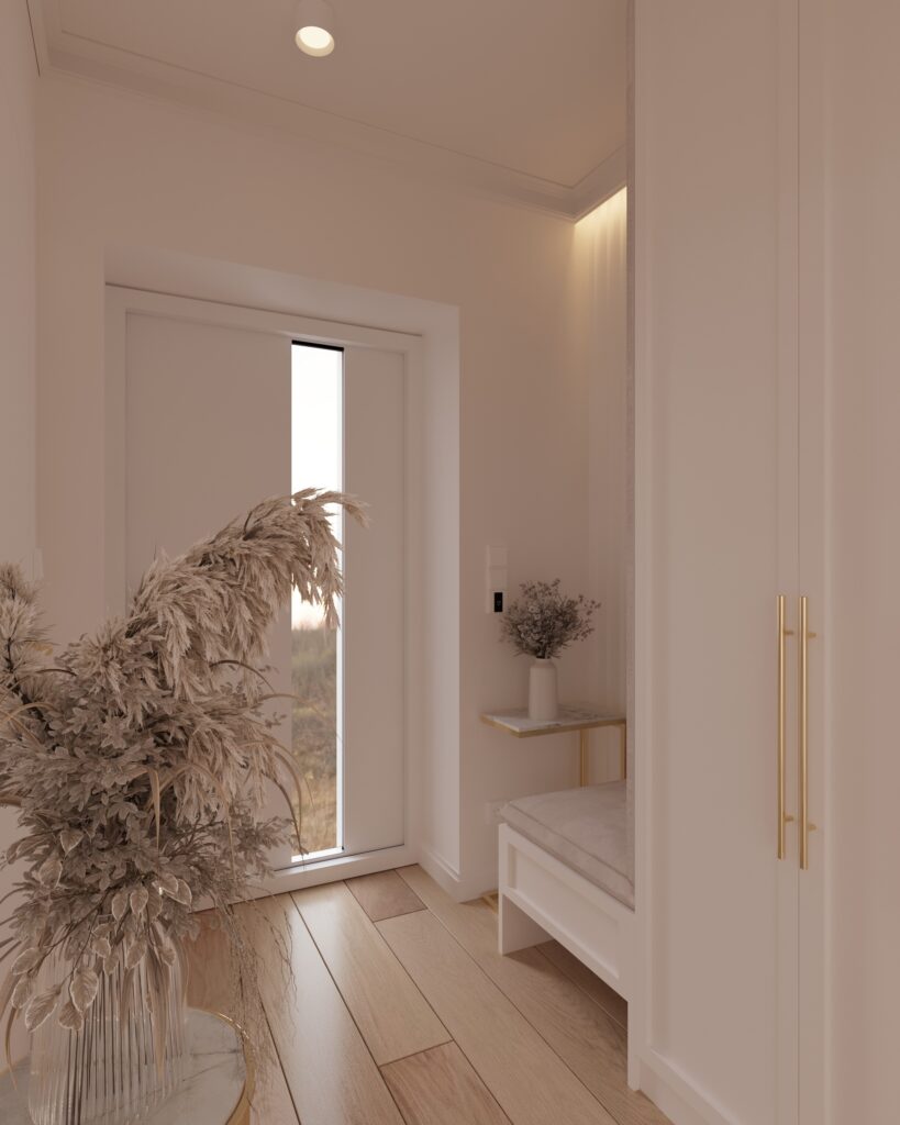 wiatrołap 1c Na pierwszym planie są drzwi prowadzące do innego pomieszczenia. Obok nich wisi ogromne lustro. Obok lustra stoi złoty stolik z wazonem i kwiatami. Na dalszym planie widać kolejne drzwi z przeszkleniem. Na podłodze są panele. Całość pomieszczenia jest jasna i elegancka.